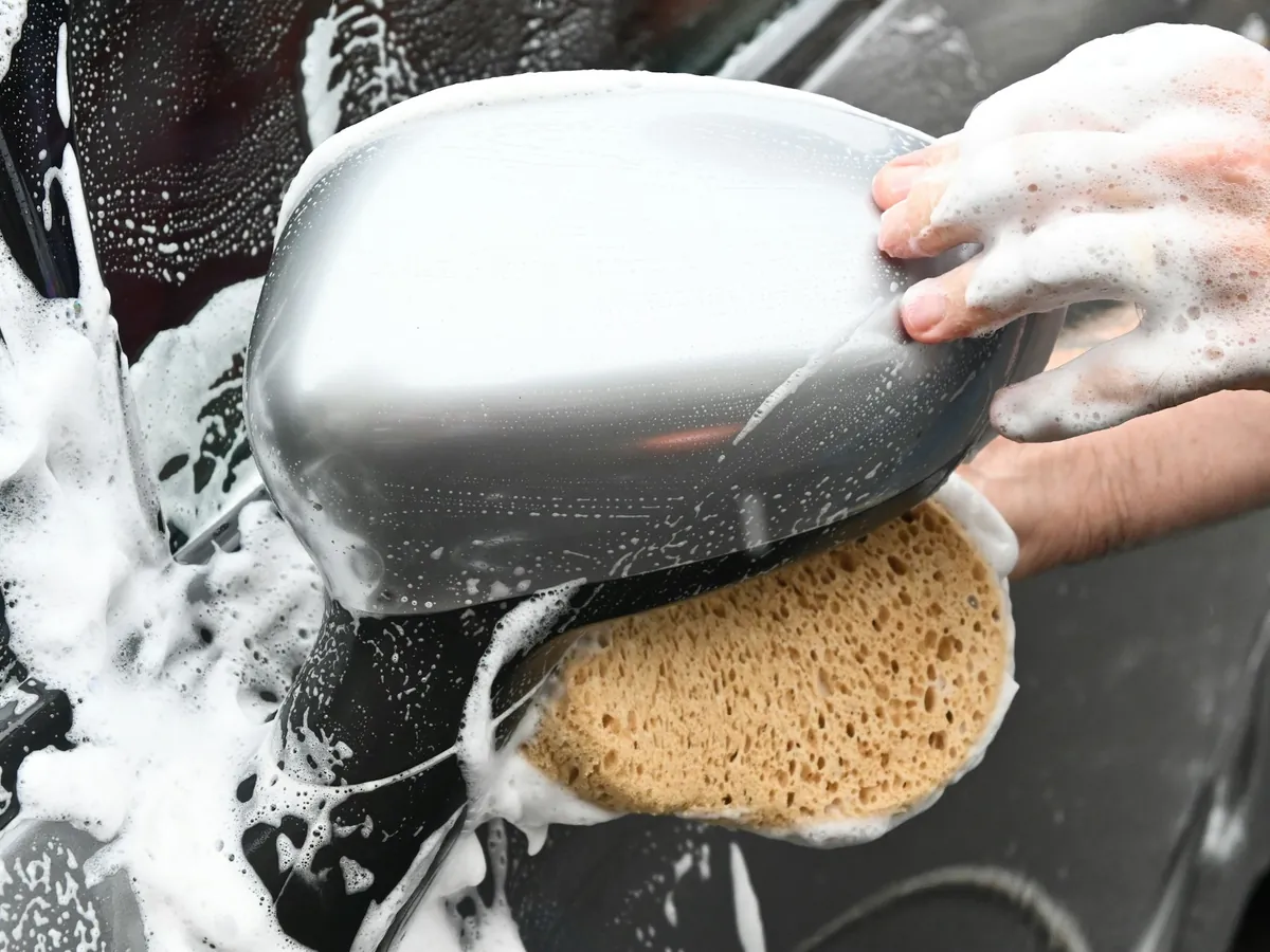 A soapy sponge on a car