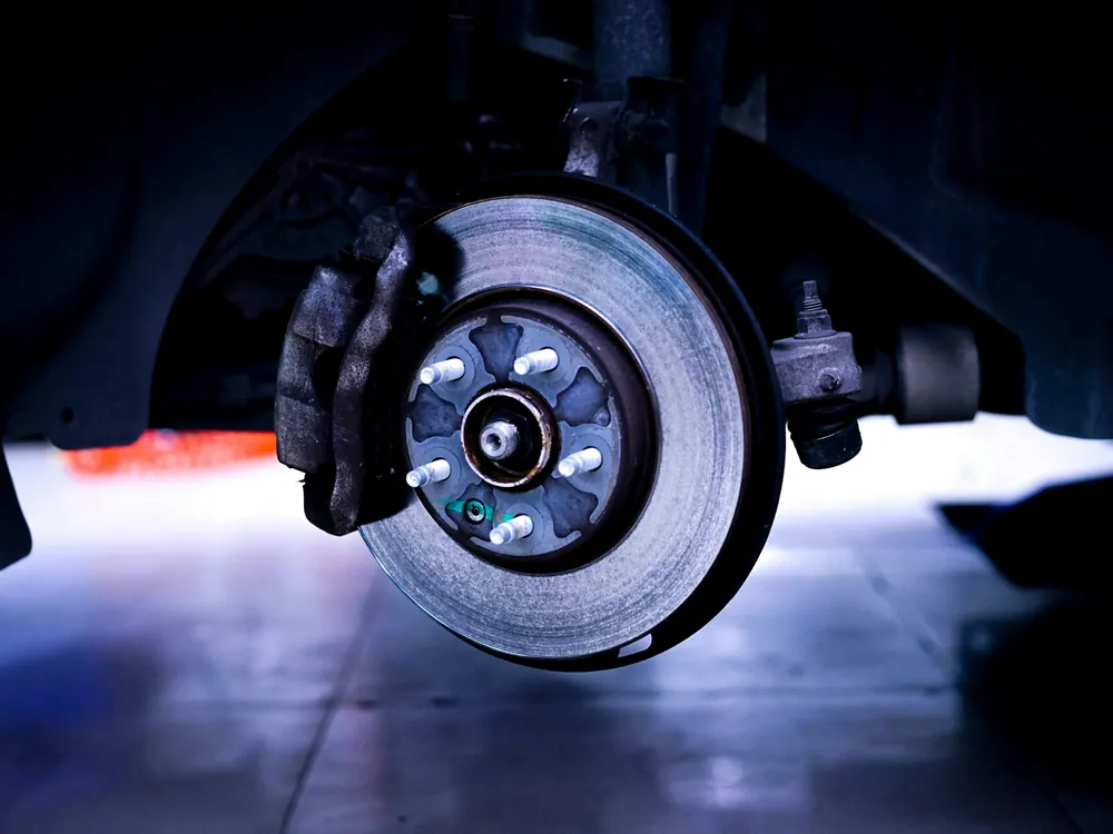 A brake disc lit up close