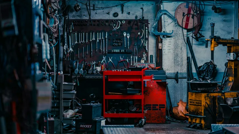 A repair shop with tools and a red tool chest
