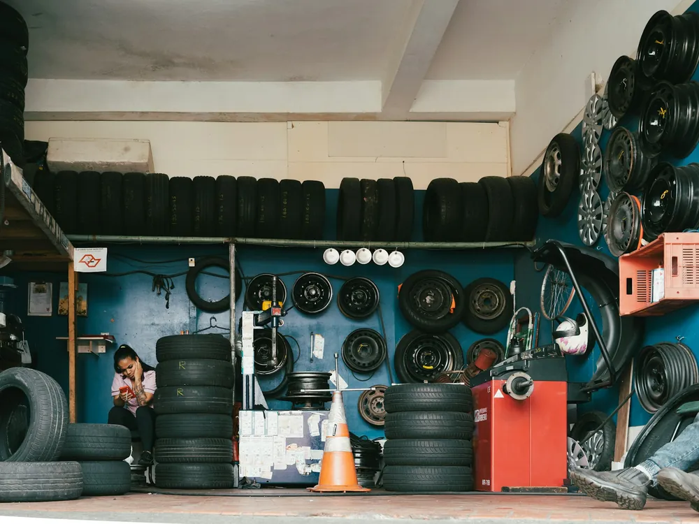 A tire shop with racks of tires