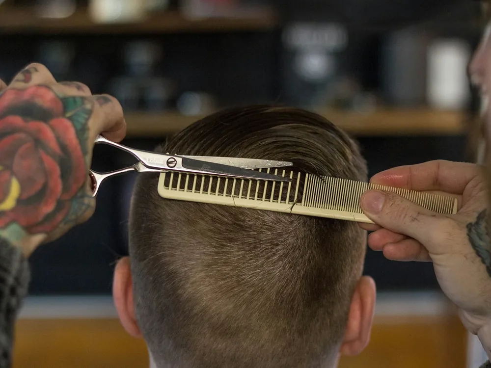 Clippers and a comb at the back of a haircut