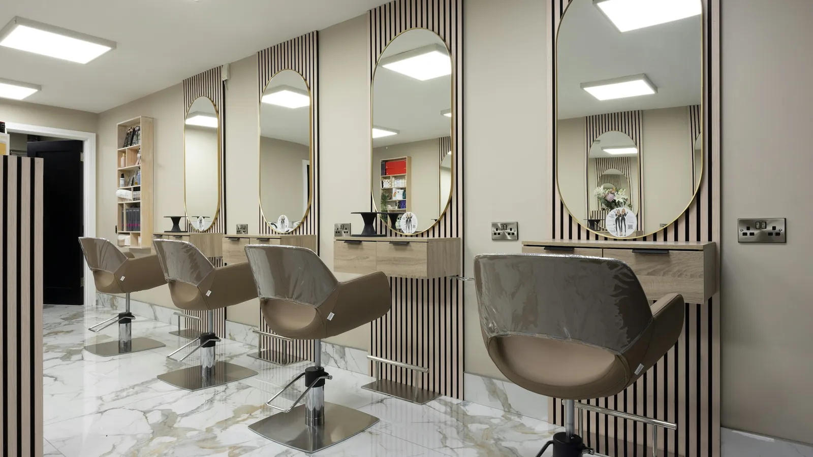 A salon with chairs and mirrors