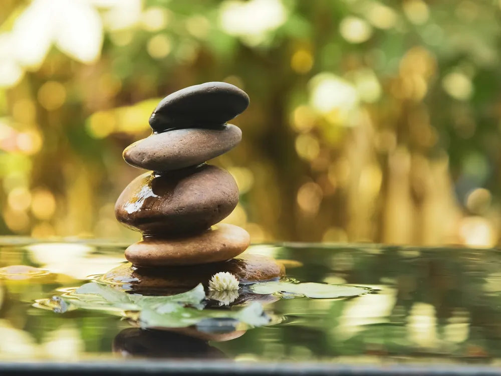 Stacked stones by water