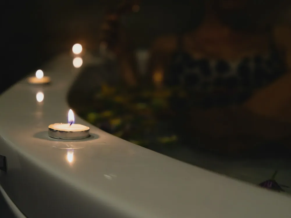 Candles lit in a dark room