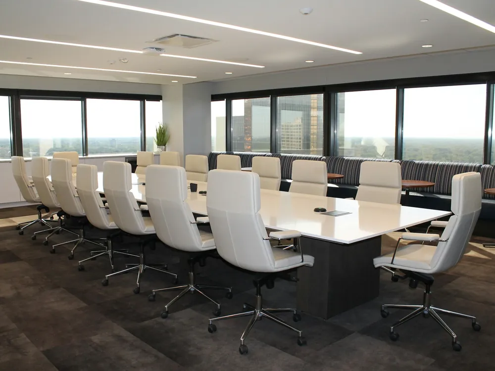A meeting room with a long table