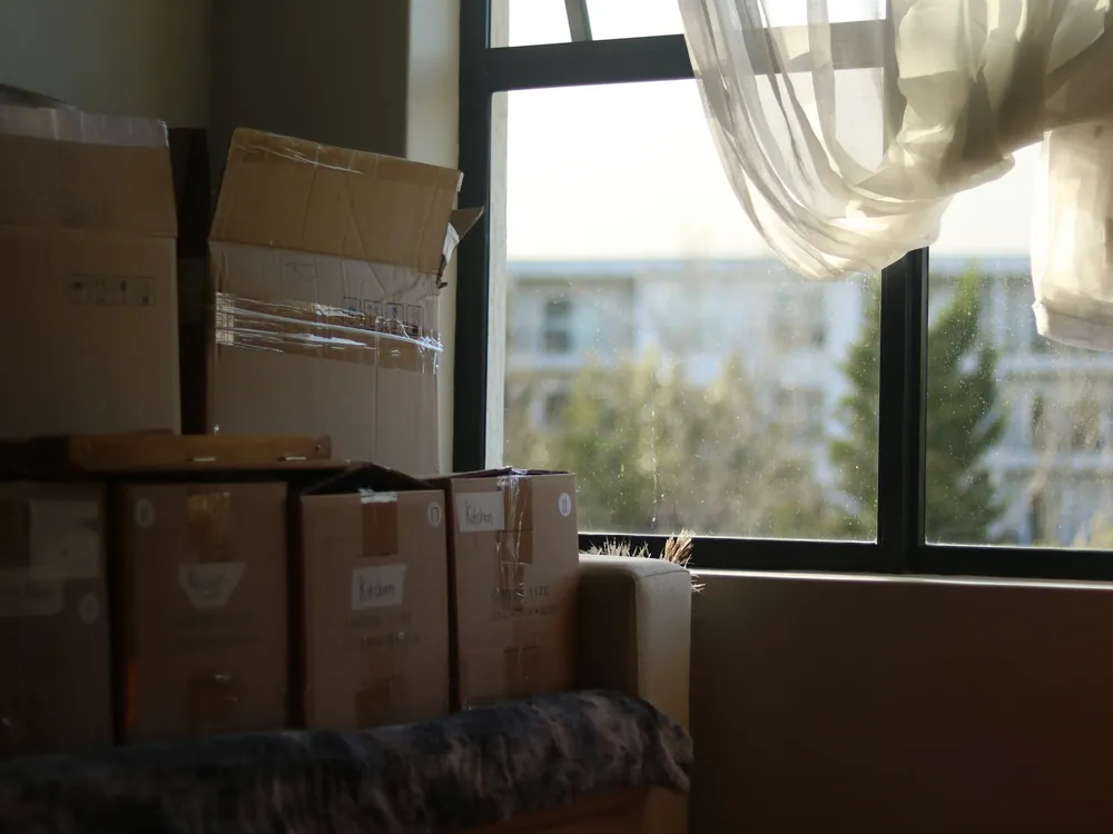 Boxes stacked by a window