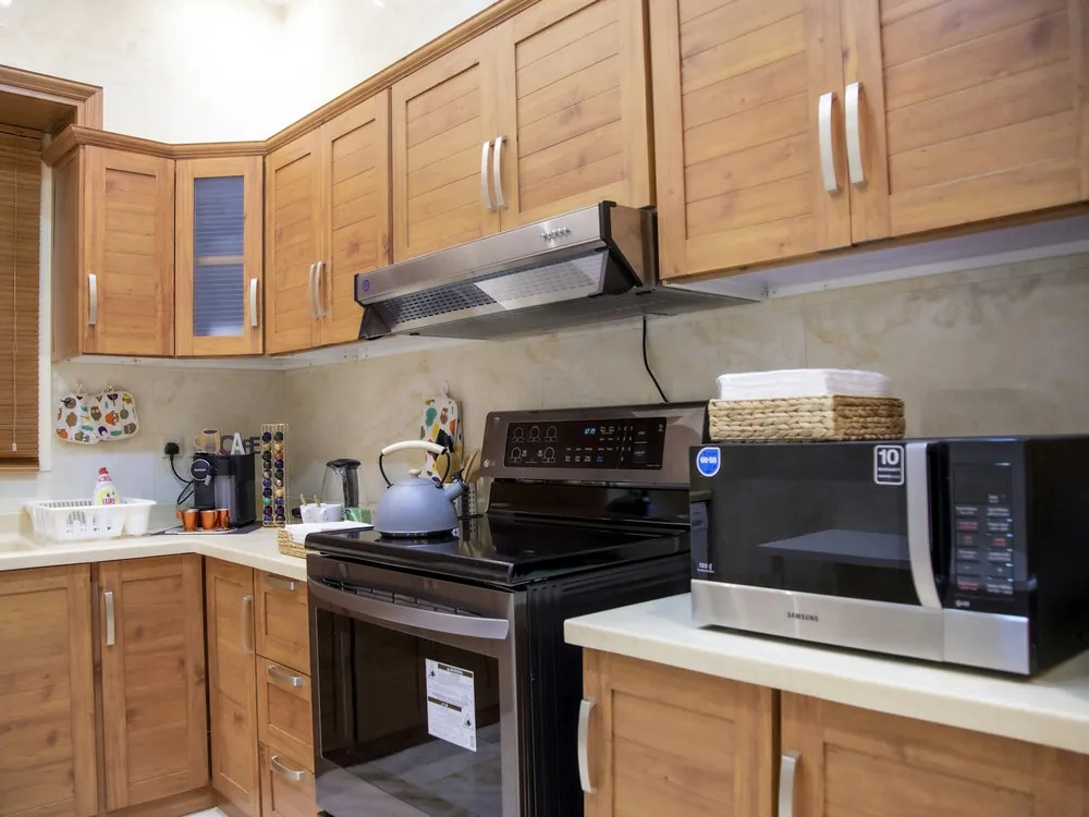 A kitchen with wooden cabinets