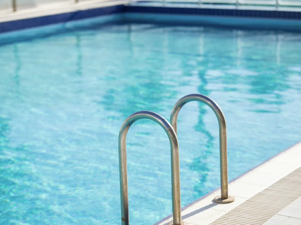 A pool ladder in clear water