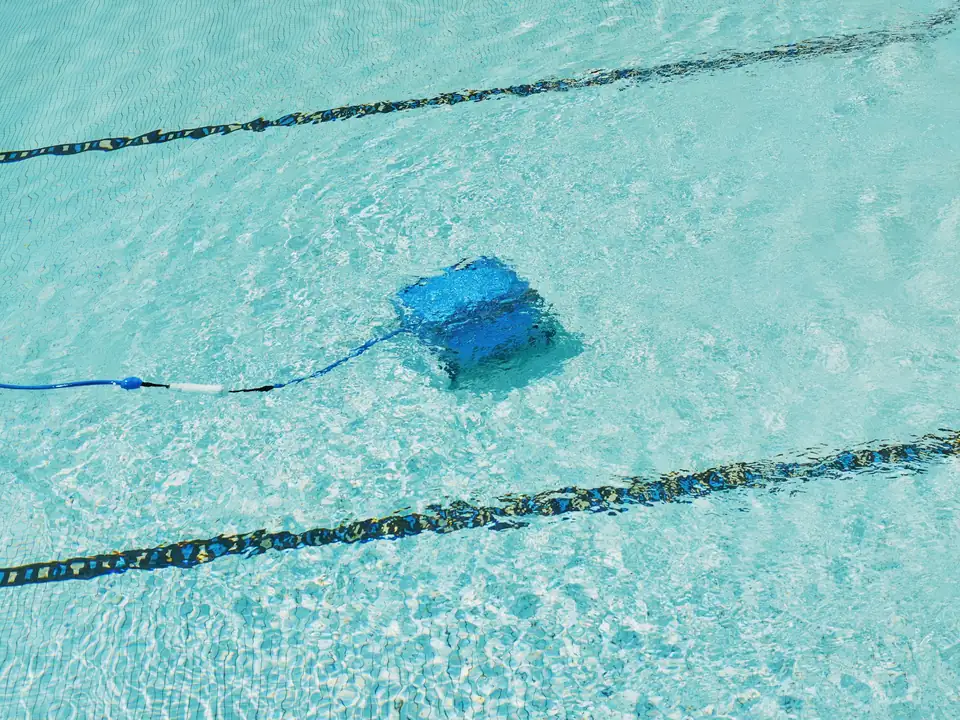 A robotic cleaner on a pool floor