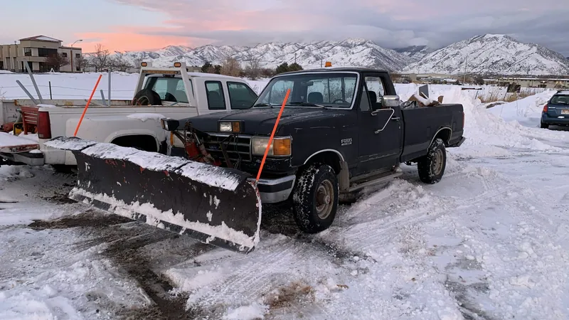 A pickup truck with a snow plow