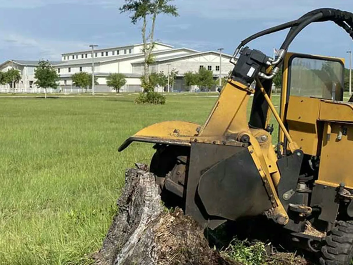 A stump grinder on a lawn