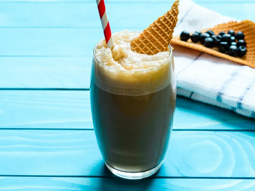 A milky iced drink with a straw