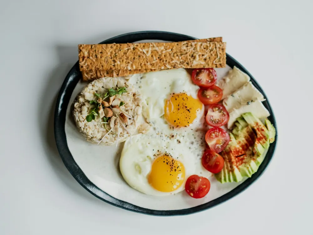 Eggs and salad on a white plate