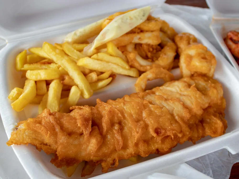 Fish and chips in a takeaway tray