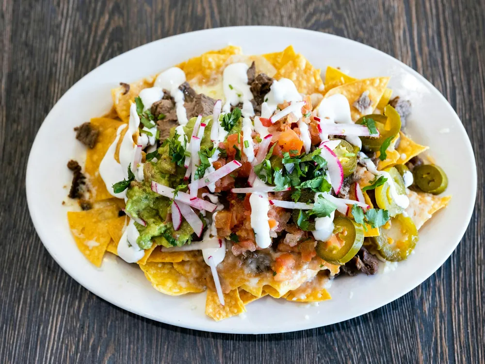 A plate of loaded nachos