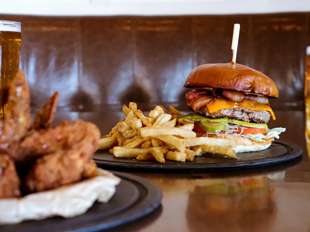 Wings and a burger with fries