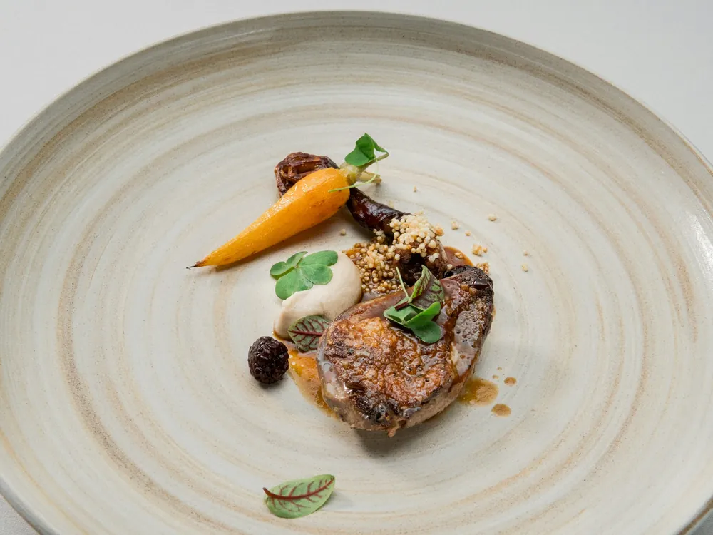 A plated main course on a white dish