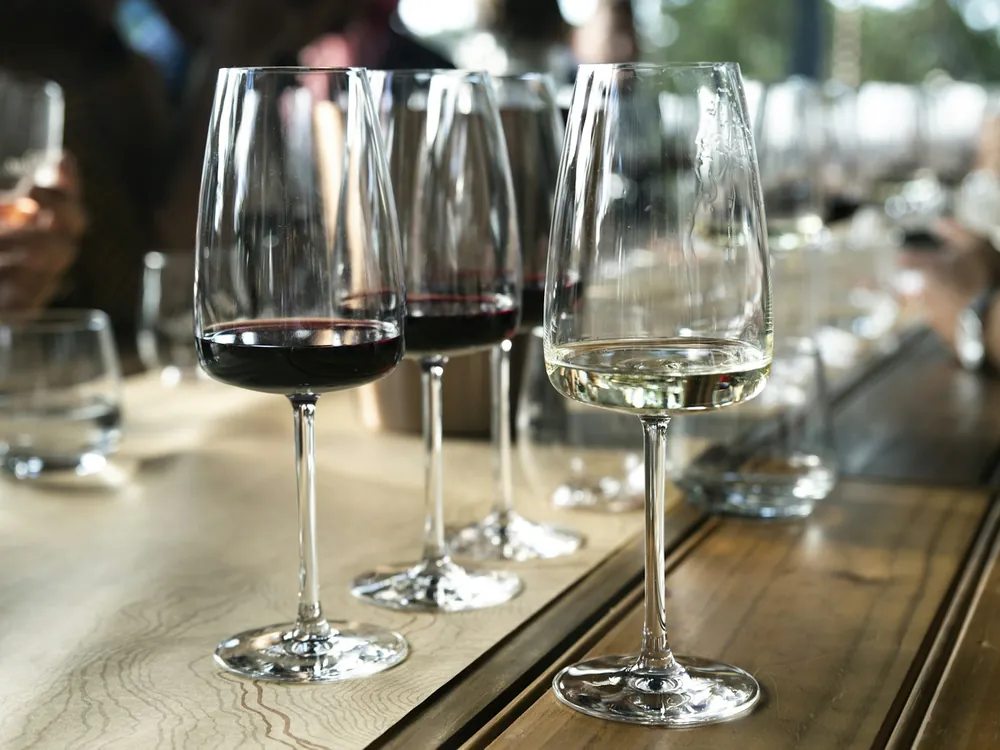 Wine glasses on a long dinner table