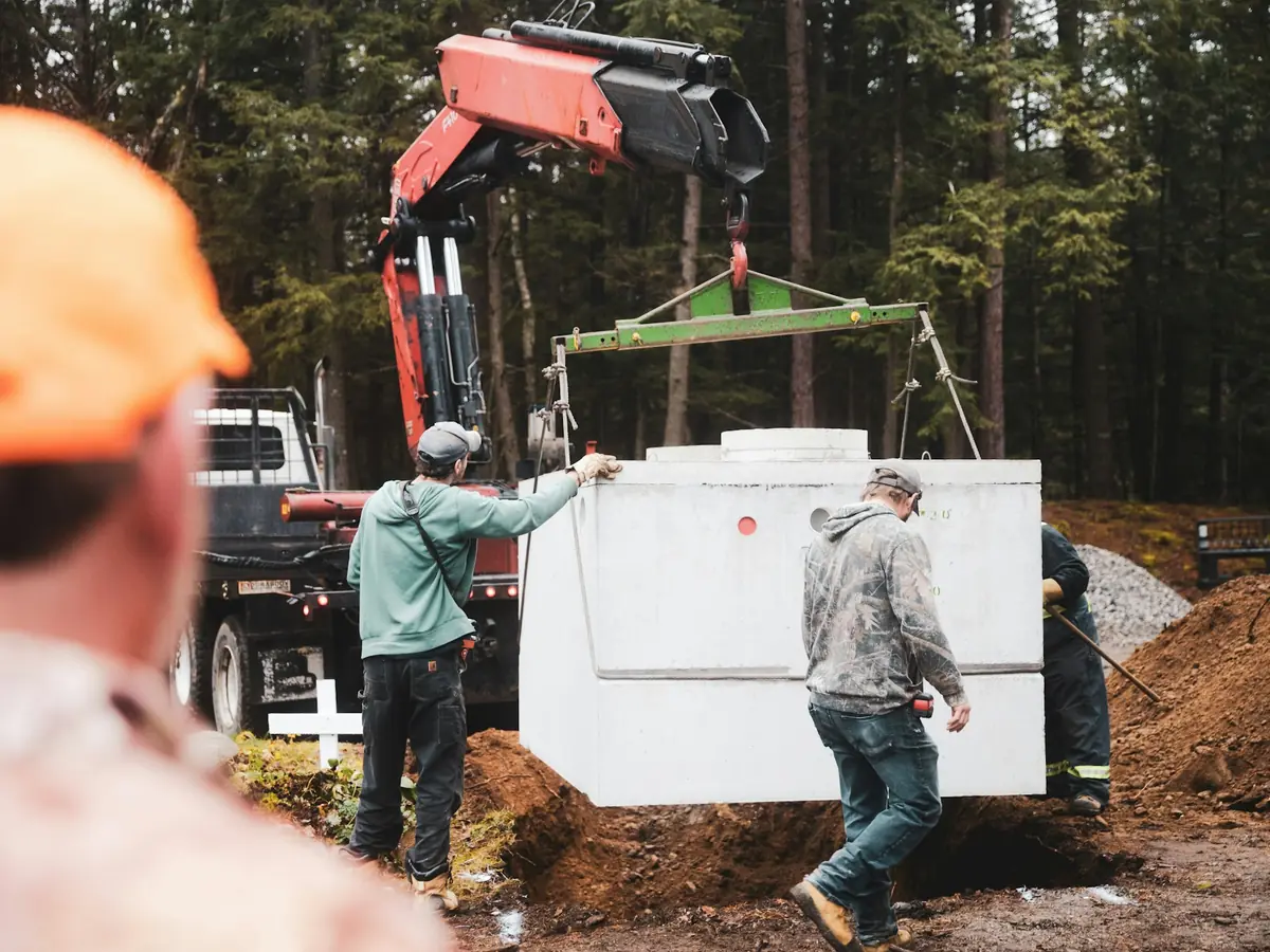 A septic tank being set into place