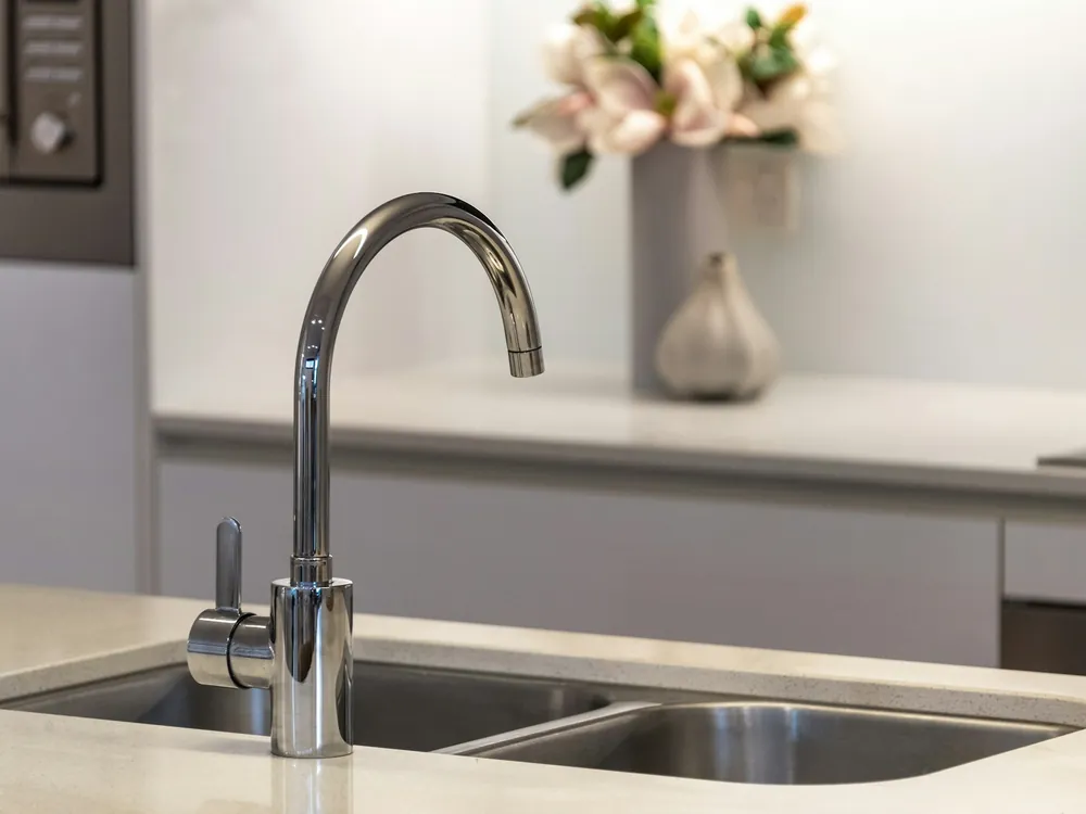 A kitchen sink and faucet