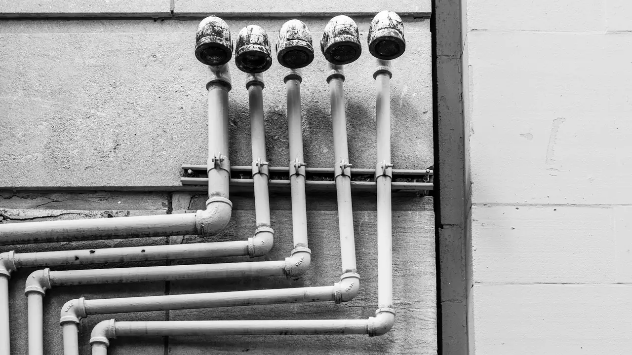Water pipes and valves on a wall