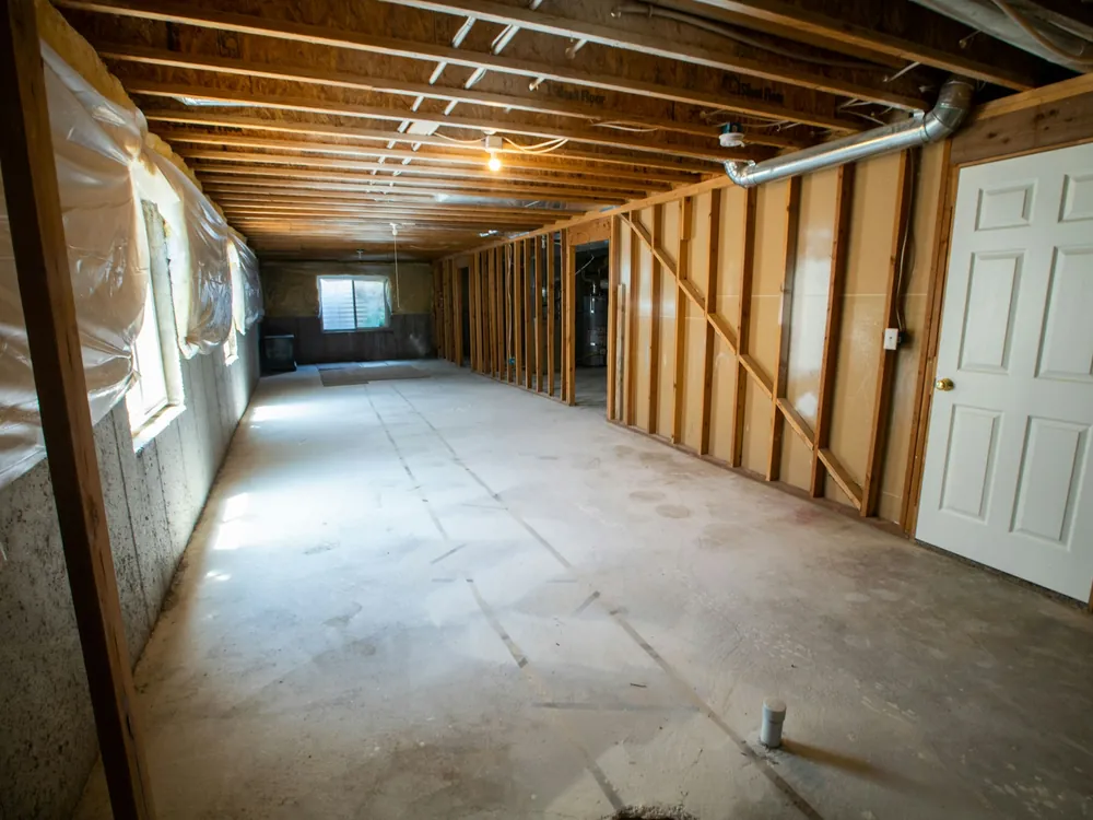 A basement with new framing