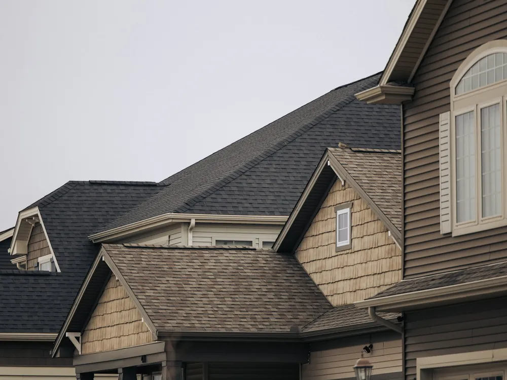House roofs with brown shingles